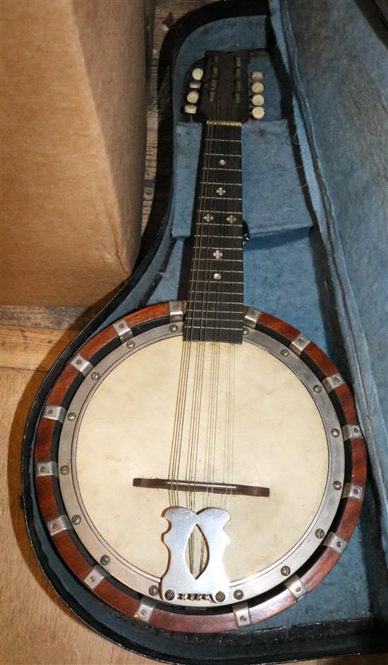 Two cased ukuleles